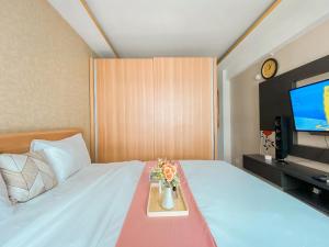 Best Deal and Homey Studio Grand Sentraland Karawang Apartment By Travelio