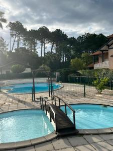 Appartements Le Cocon - Detente sous les pins avec piscine partagee : photos des chambres