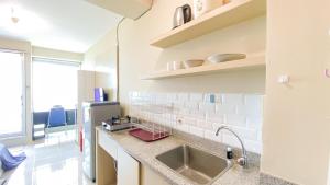 Good Place and Tidy Studio Tifolia Apartment By Travelio