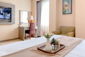 Best Deal and Homey 1BR No Kitchen at Grand Palace Kemayoran Apartment By Travelio