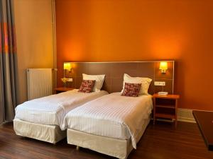 Appart'hotels Garden & City Luxeuil Ex Le Metropole et Les Thermes : photos des chambres