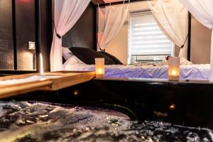 Appartements Gite & Spa Privatif Glam'88 - Vosges : photos des chambres