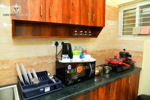 Omicron Comforts 1BHK 2BHK Service Apartment