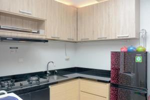 Scenic 1BR with City View at The Mansion Kemayoran Apartment By Travelio
