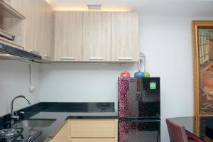 Scenic 1BR with City View at The Mansion Kemayoran Apartment By Travelio