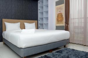 Scenic 1BR with City View at The Mansion Kemayoran Apartment By Travelio
