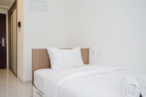 Nice and Comfort Studio Room at Sky House BSD Apartment By Travelio
