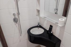 Nice and Comfort Studio Room at Sky House BSD Apartment By Travelio