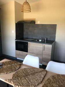 Appart'hotels Residence Cosyade equipee d'un parking prive gratuit : photos des chambres