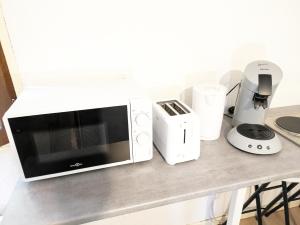 Appartements Le Nanty - Appartement Duplex Cosy et Central- Acces Gare et Centre Ville : photos des chambres