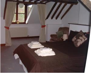 One-Bedroom House - The Snug room in Horseshoe Pass Holiday Lets