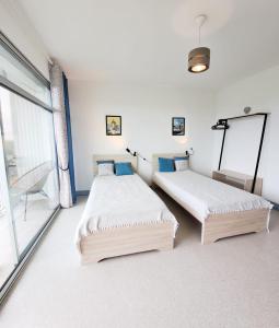 Appartements L-Oceanic - APPARTEMENT VUE MER, 50m DE LA PLAGE, RESIDENCE, TERRAIN DE TENNIS, WIFI : photos des chambres