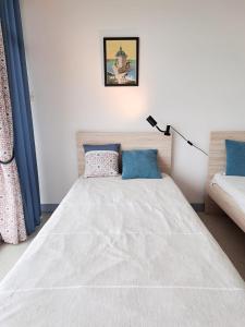 Appartements L-Oceanic - APPARTEMENT VUE MER, 50m DE LA PLAGE, RESIDENCE, TERRAIN DE TENNIS, WIFI : photos des chambres