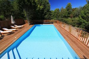 Appartements Wooden lodge with garden : photos des chambres