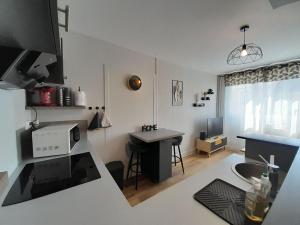 Appartements Ravissant appart' central : photos des chambres