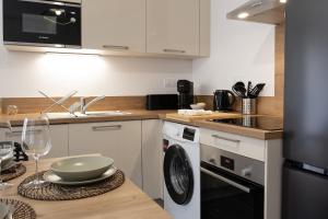 Appartements Le Normand - Spacieux T4 neuf avec 3 salles d’eaux : photos des chambres