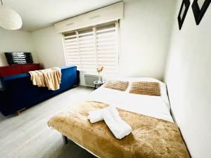 Appartements Saint Exupery Parking Wifi Un Sejour a Part : photos des chambres