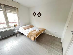 Appartements Saint Exupery Parking Wifi Un Sejour a Part : photos des chambres