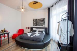 Appartements L'Hyper Centre - Netflix & Wifi - Literie Haut de Gamme - check-in 24H24 - GoodMarning : photos des chambres