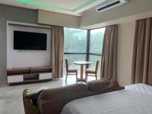 Flat confortável no Tropical executive hotel