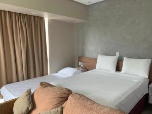 Flat confortável no Tropical executive hotel