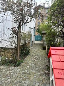 Maisons de vacances Petite maison calme dans un jardin : photos des chambres