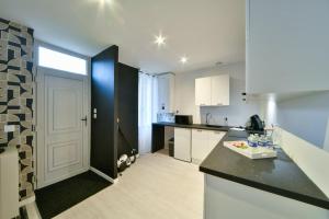 Appartements OIQIA • Dichroma : photos des chambres