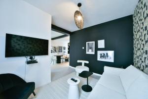 Appartements OIQIA • Dichroma : photos des chambres