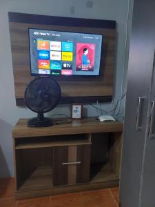 Kitnet geminada próximo da praia