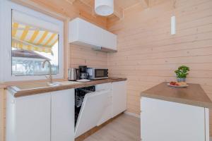 Całoroczne Drewniane Domki w Urokliwej Okolicy by Noclegi Renters