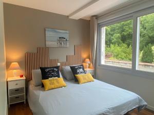 Appartements Appartement dans villa Bauloise T3 : photos des chambres