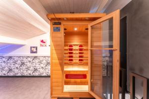 Appartements Appartement avec Jacuzzi Sauna : photos des chambres