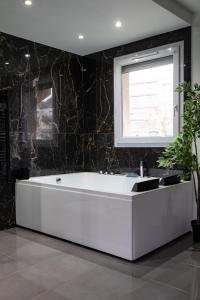 Appartements Evasion romantique avec jacuzzi : photos des chambres