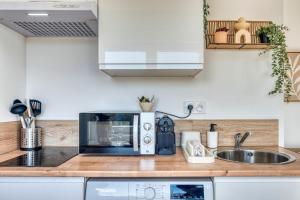 Appartements La Suite Creme - Metro D - Gare de Venissieux : photos des chambres