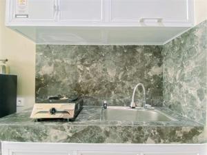 Warm and Homey Studio at Royal Sentul Park Apartment By Travelio