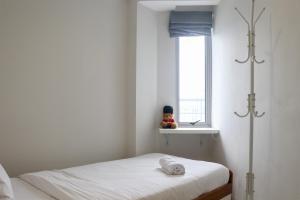 Restful 2BR at The Mansion Kemayoran Apartment near JIEXPO By Travelio