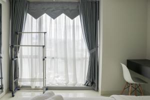 Restful 2BR at The Mansion Kemayoran Apartment near JIEXPO By Travelio