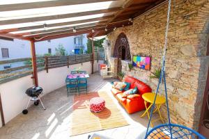 stone cottage with a terrace