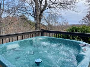 Stunning 2 bedroom with a hot tub and fireplace in an exclusive gated community with seasonal pool!
