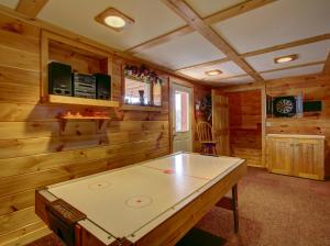 Smoky Mountain view from the hot tub at this charming log cabin with game room and jacuzzi tub!