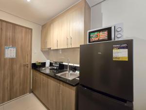 1BR Condotel with Balcony at FAME Residences #FM64
