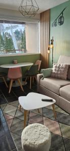 Appartements LA PETITE LUGE studio sur les pistes centre station Super-Besse : photos des chambres