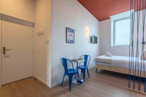 Appartements Studio equipe cote rue, parking gratuit : photos des chambres