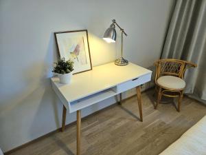 Stylish top floor ap, with private parking, next to a tram stop