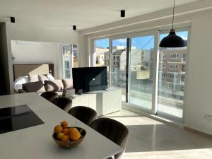 Waters Edge Suite Xlendi Direct Seafront with Private Roof Top Jacuzzi