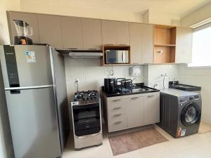 606 Apt 2Q a 850 metros da praia com área Laser