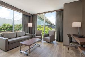 Guest Corner Room with King Bed and Sofa room in AC Hotel by Marriott Pittsburgh Downtown