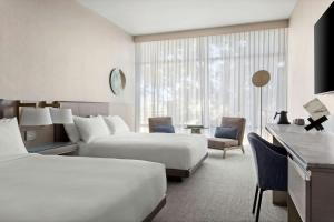 Queen Guest Room with 2 Queen Beds and Courtyard View room in TETRA Hotel Autograph Collection