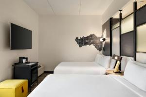 Queen Room with Two Queen Beds room in Aloft Wilmington at Coastline Center