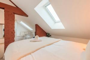 Studio sous les combles côté rue, parking gratuit